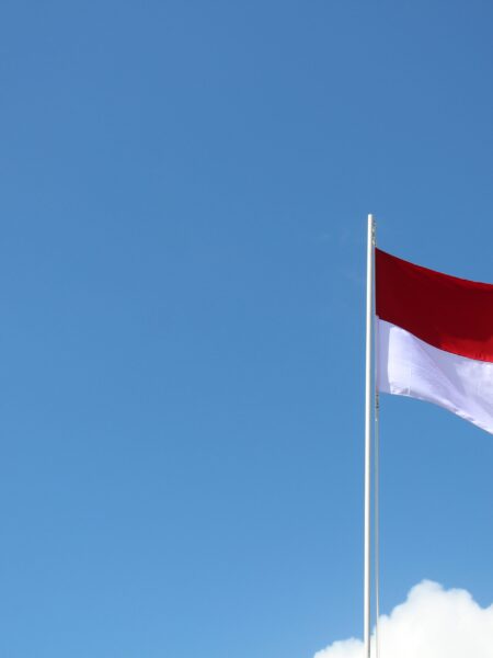 Indonesian flag blowing in clear skies