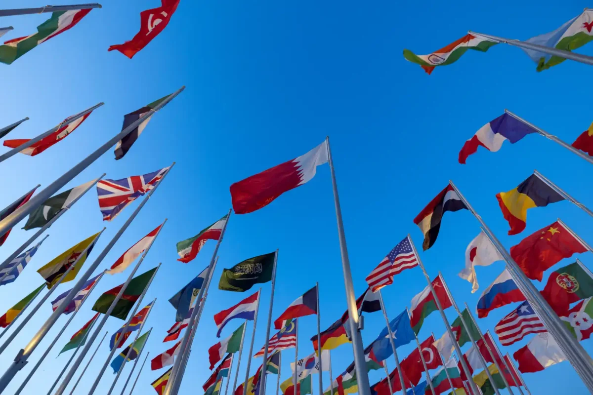 International flags representing Algeria joining the Hague Apostille Convention and simplifying international document authentication.