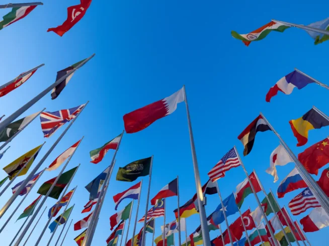 International flags representing Algeria joining the Hague Apostille Convention and simplifying international document authentication.