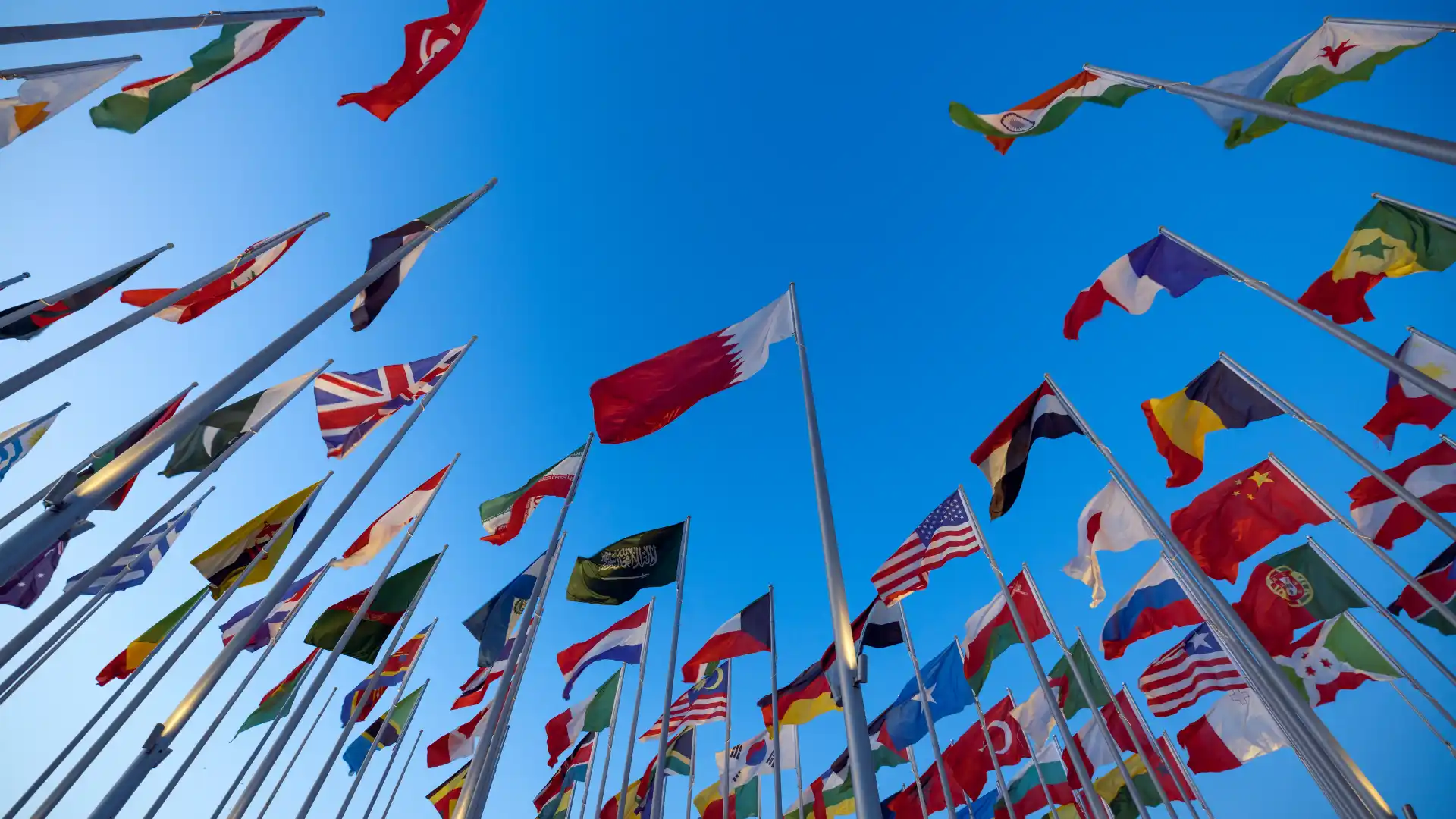 International flags representing Algeria joining the Hague Apostille Convention and simplifying international document authentication.